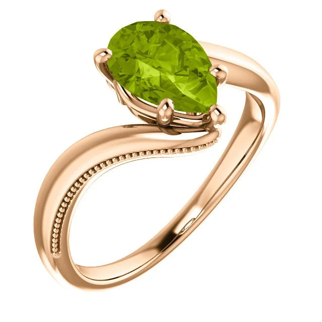 14KT GOLD 1.50 CTW PEAR SHAPE PERIDOT RING