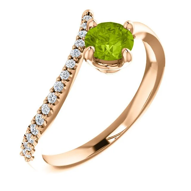 14KT GOLD 0.55 CT PERIDOT & 0.10 CTW DIAMOND ACCENT BYPASS RING